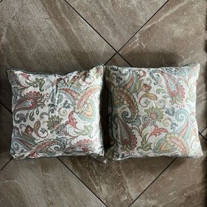 Set of 20x20 inch paisley print throw pillows.